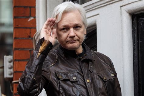 what is assange charged with